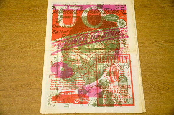 Front or Back cover of a News Paper. A black and white photo of a man's head. Overlays of various images such as; a map, a vintage car, an ad for tobacco, an etc in red or magenta color are on top of the black and white image. 