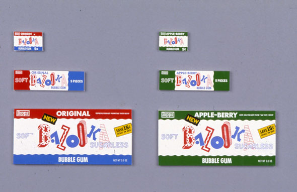 A photo of multiple packages for Bazooka gum. One the left side are 3 packages (smallest to largest) for Bazooka original flavor bubble gum. The packages have red white and blue stripes and "Bazooka" in the middle with each letter in different front and size.  On the right are similar packages but has only white and green stripes, it's for Bazooka's Apple berry flavored bubble gum.  