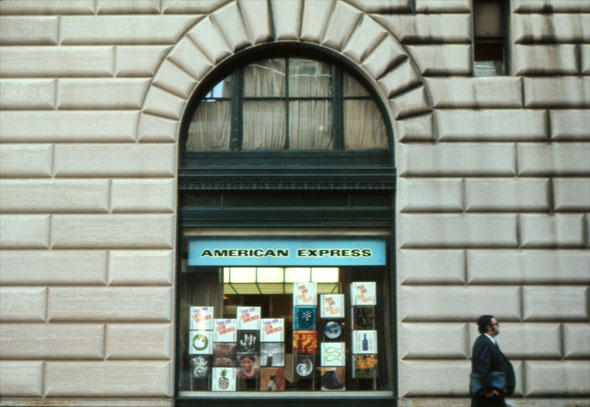American Express window viewed from the street, covered in colorful panels