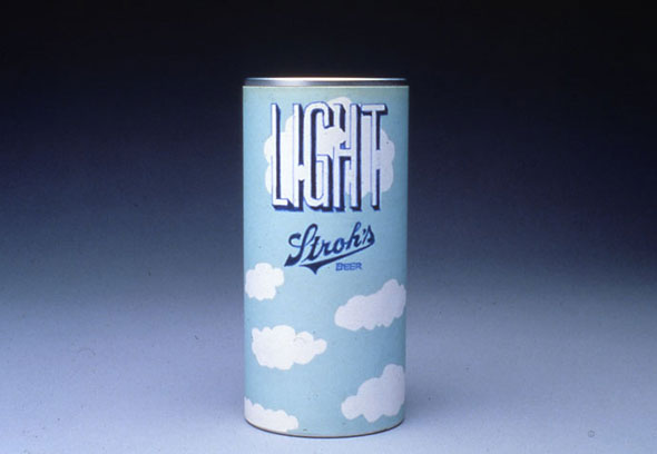 A photo of a small beer can. The can is sky light blue, it has white fluffy clouds scattered around the can. "LIGHT" is in big thin white letters with a navy blue outline. The word in front of a big white cloud, some of the cloud covers some parts of the letters. Underneath is the brand name, "Stroh's" in a smaller blue scripted text. 