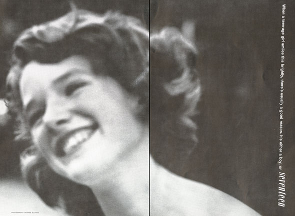 Black and white, somewhat blurry photo of a smiling girl