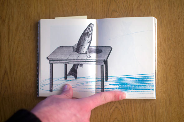 Flipbook opened to show a spread  containing a fish in a table against a white background