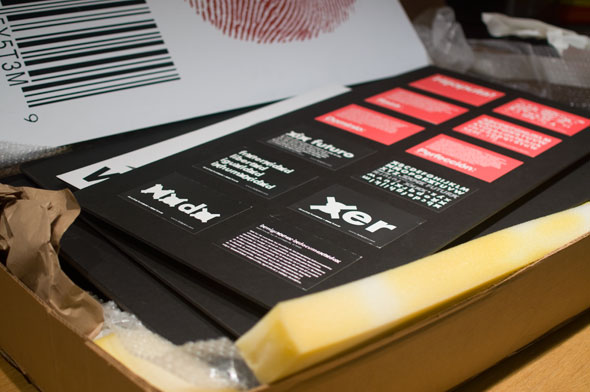 A photo of black postcards in a box