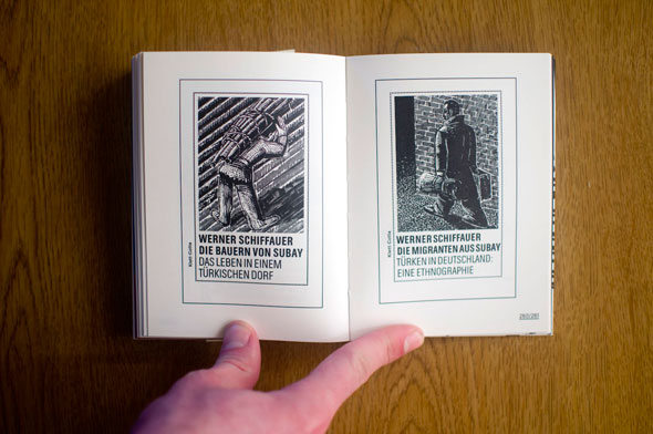 Flipbook opened to show a spread depicting two black and white illustrated posters, left with a man carrying a bundle of sticks on his back and right with a man carrying two bags