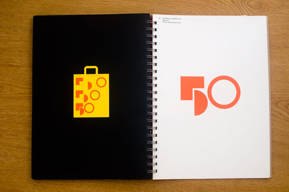 Spread; right is an orange collection of geometric shapes that form the number "50" against a white background; left is a yellow shopping bag with the same logo against a black background