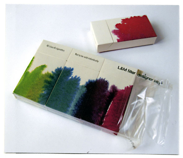 A photo of a package of cigarette packs. 3 of the packs are still in the plastic packaging wrap, the 4th one is out of the package. Each cigarette pack has a wet-on-wet watercolor design. When in the plastic wrap the 4 cigarette packs' design connect with each other, forming a green-blue-purple-magenta-red gradient. The water color design on each pack is a simple vertical brush stroke from the bottom to half way of the pack. The background is a plain cream white color. 