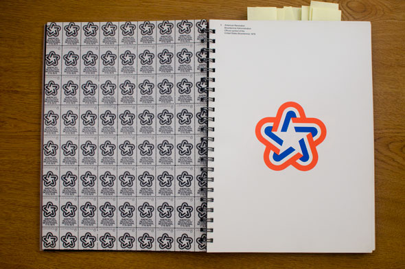 Spread; right page contains a red, white and blue graphic of a star, left page is the same graphic tiled in black and white