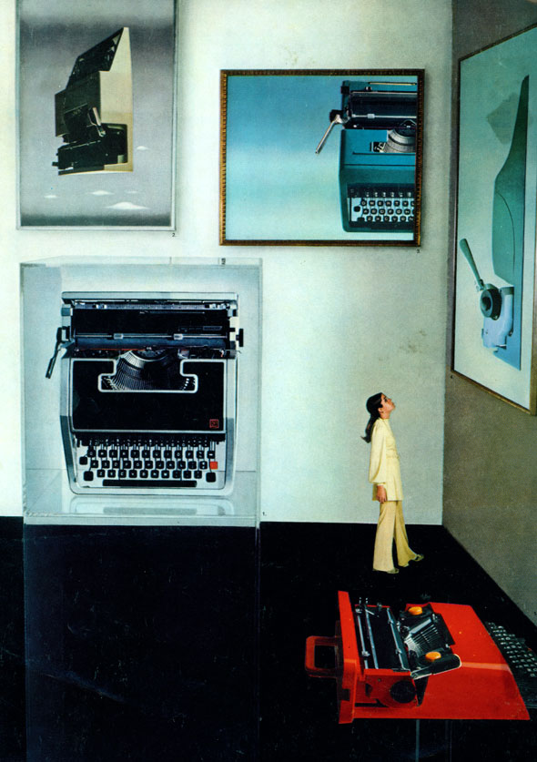 A photo of a woman in white looking at images in a gallery show; all are enlarged photos of different models of typewriters