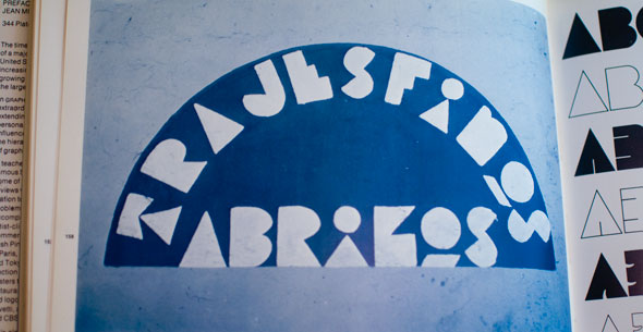Blue semicircle filled with white block text against light blue background
