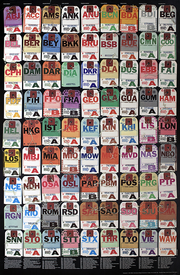 Colorful luggage tags originating from various locations all closely aligned with one another. 