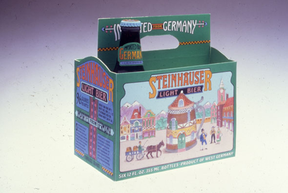 A photo of a 6-pack of beer bottle cartoon. There is only one beer bottle in the carton. The carton is mostly a grassy green color. The front has a brightly colored illustration of a small town with a beer stein styled house right in the middle of the town. Above the illustration is the brand, "Stienhauser" in big orange-yellow colored text. On the side are 4 dark blue square, it looks like a window, each square has a text. 