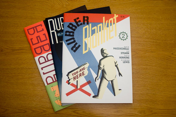 Photo of Three colorful magazines arranged on a table