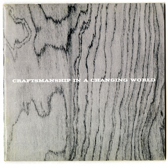 A cover of a catalog. The whole page has a wood texture and in the center is "Craftsmanship in a Changing World" in a white bold lettering that is all uppercased. 