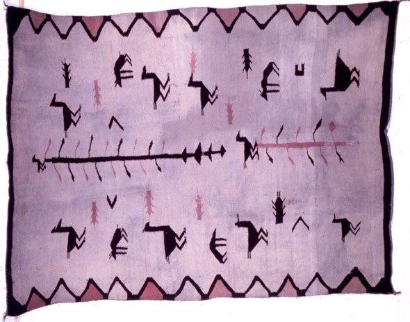 A hand-made rug. The left and right side of the has a dark purple border and the top and bottom side has a triangle pattern design as a border and at each corner has a small dark purple tassel. The base color of the rug is a pastel purple and the rug has a design of two parallel horizontal lines of animals. The animals are very angular and dark purple. Between the line of animal is a horizontal line with leaves sprouting from it, it's a vine.  